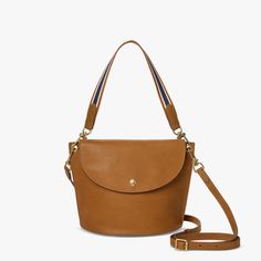 Convertible Birdy Bucket Bag | Shinola® Detroit Leather Bucket Satchel For On-the-go, Leather Handle Crossbody Bucket Bag For On-the-go, On-the-go Satchel Shoulder Bag With Brass Hardware, Bucket Bag With Brass Hardware, Versatile Bucket Bag With Gold-tone Hardware, Versatile Bucket Tote Bag With Gold-tone Hardware, Modern Bucket Shoulder Bag With Brass Hardware, Chic Bucket Bag With Brass Hardware Tote, Modern Bucket Bag With Brass Hardware For Daily Use