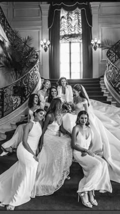 a group of women sitting next to each other on top of stairs