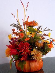 a vase filled with flowers sitting on top of a table