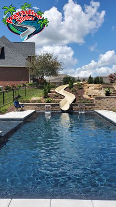 an empty swimming pool with a slide in the middle