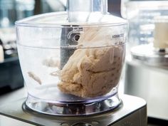 a blender filled with food on top of a counter