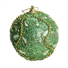 a green ornament with lots of beads on it