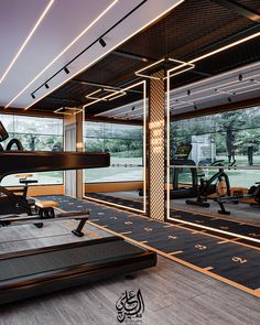 an empty gym with treadmills and exercise machines in the background, surrounded by large windows