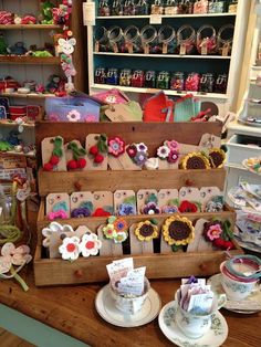 there are many items on display in the store, including tea cups and saucers