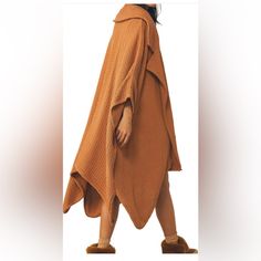 Poncho Waffle Jacket In Brown Almond Oversized Long Brown Outerwear, Oversized Beige Lagenlook Outerwear, Brown Fall Cape Outerwear, Oversized Brown Poncho Cape, Chic Fall Outerwear With Batwing Sleeve, Chic Batwing Sleeve Fall Outerwear, Beige Lagenlook Outerwear For Fall, Oversized Beige Cape Outerwear, Lagenlook Long Sleeve Poncho