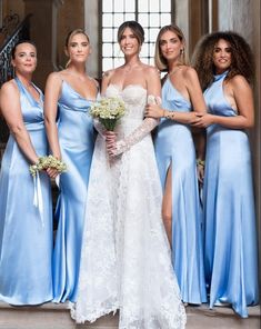 the bridesmaids are all dressed in blue dresses