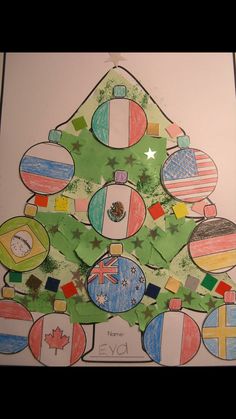 a child's christmas tree made out of paper with flags on it and stars