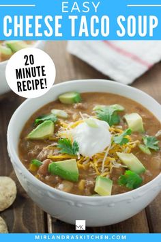 a white bowl filled with chili cheese taco soup and topped with sour cream on top