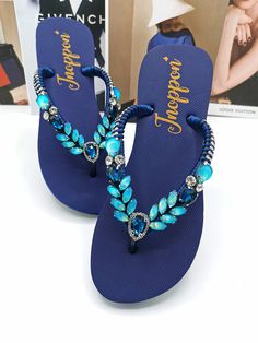 Description The beautiful rhinestone and customizable Flip Flops for the beach brides, bridesmaids, vacation, honeymoon or any occasion you desire to look gorgeous. Perfect in any outfit! Being unique and stunning on design, these flip flops must be your must-have item! The sandal is anti-slip, comfortable and durable as it is made from high quality rubber from the South of Thailand, where is famous for the best rubber tree. Moreover, the crystals are decorated on the sandal with effective adhes Blue Toe Post Sandals For Party, Blue Toe Post Party Sandals, Elegant Open Toe Beach Flip Flops, Elegant Open Toe Flip Flops For The Beach, Elegant Embellished Flip Flops For Vacation, Summer Party Flip Flops With Rhinestones, Elegant Rhinestone Sandals For Beach Season, Elegant Adjustable Flip Flops For Beach, Elegant Rhinestone Flip Flops For Summer