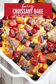 a casserole with berries and powdered sugar on top