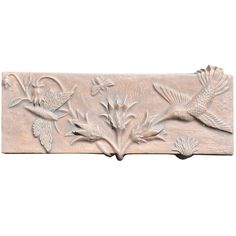 a decorative wall panel with birds and flowers on the border, painted in light gray