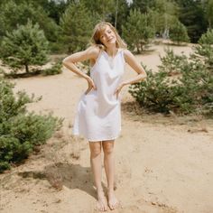 "PRODUCED in 3-5 days FAST & FREE shipping with DHL Express Courier -10% for all items with code \"FAVOURITE\" A mini linen dress, featuring an A-line silhouette and two side pockets is charming and comfortable at the same time. Match it with your favorite sandals or hat! Details: - 100% Linen - Pure linen fabric - Boat neck - Sleeveless - Two side pockets - Above knee length - A-line silhouette - Model's height is 172 cm / 5'7'' wears size M - Code: E9010-L532-151 The dress is available in other colors. You can find them in the gallery. If you want to order the dress in another color, please specify it in the personalization field. Sizing: This garment is true to size, and we recommend choosing the size you usually wear. If you want the garment to be loose-fitting, choose a larger size th Dress Minimal, Sleeveless Linen Dress, Model Poses Photography, White Sleeveless, Dress With Pockets, Pure Linen, Model Poses, Linen Dress, Natural Fabrics