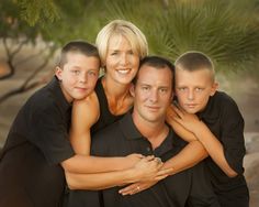 a family is posing for a photo together