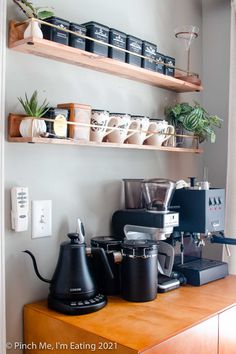 the coffee maker is sitting on top of the counter