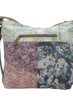 A perfect blend of style, functionality, and durability, this bag is designed for the modern woman on the go. The unique patchwork design combines vibrant floral prints on canvas with high-quality leather accents, creating an eye-catching piece that adds a splash of color and elegance to any outfit. The exterior of the bag boasts three convenient zipper pockets (one on the back and two on the front), ensuring your essentials are secure yet easily accessible. The full zip-top closure further secu Spring Canvas Crossbody Shoulder Bag, Multicolor Canvas Shoulder Bag For Spring, Patchwork Hobo Bag For Everyday Use, Fabric Travel Bag For Spring, Trendy Floral Print Travel Shoulder Bag, Trendy Travel Bag With Floral Print, Spring Travel Bag Made Of Fabric, Casual Multicolor Canvas Satchel, Floral Print Satchel For Everyday Use