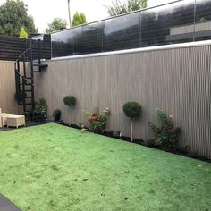 an outdoor area with grass and stairs