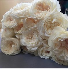 a bunch of white flowers sitting on top of a table