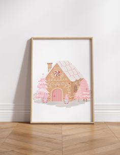 a house with pink trees on the front and bottom is shown in a wooden frame