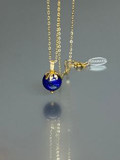 This pendant necklace showcases a natural Royal blue Lapis Lazuli pendant with a stunning deep blue color. The pendant is adorned with a beautiful 14K gold-filled flower cap, and it's gracefully strung on either a 14K gold-filled or Sterling Silver chain, making it versatile for layering with other necklaces or as a striking stand-alone piece. The necklace exudes a luminous and sparkly quality, ensuring you'll shine brilliantly when wearing it.  * Quality: High-quality lapis sphere * Stone Shape Jewelry Layering Necklace, Jewelry Layering, January Birthstone Jewelry, Natural Gemstone Necklace, Lapis Necklace, Chain Making, Lapis Lazuli Jewelry, Lapis Lazuli Pendant, Lapis Lazuli Necklace