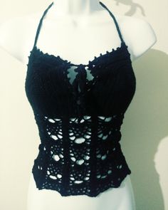 a mannequin wearing a black crochet top