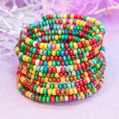 Diameter: 5.5 cm. Wooden beads. Memory wire bracelets are a unique solution for those who love bracelets and don't want to worry about their size. This wire simply wraps around the wrist, and the bracelet stays in place without a clasp. If your wrist is slimmer, opt for bracelets with a diameter of 5 or 5.5 cm, while wider wrists will suit bracelets of larger diameter. These accessories are crafted from various materials. Primarily, they consist of beads, glass and ceramic beads, wooden beads, m Handmade Adjustable Bangle With Round Beads, Adjustable Multicolor Spiritual Bangle, Adjustable Bangle With Spacer Beads For Gift, Adjustable Bangle With Spacer Beads As Gift, Festival Hand Wrapped Stretch Bracelet With Round Beads, Hand Wrapped Friendship Bracelet With Round Beads, Adjustable Wire Wrapped Beads For Jewelry Making, Unique Adjustable Wire Wrapped Beaded Bracelets, Adjustable Multicolor Bangle