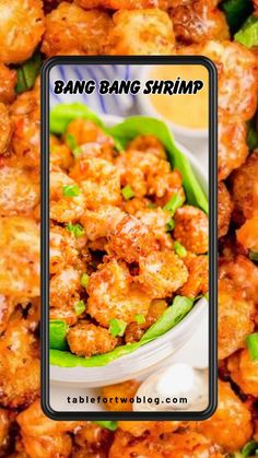 some food that is in a bowl on a table with the words bang bang shrimp