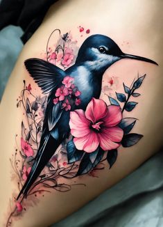 a black bird with pink flowers on it's thigh and the back of its leg