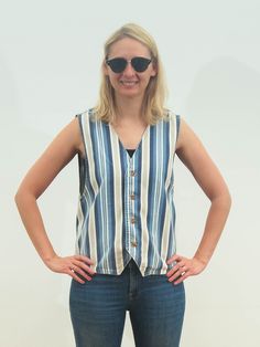 "This is great vintage striped denim vest from 90s. CONDITION: / 5 out of 5 / excellent vintage. The item is in excellent vintage condition and shows very few signs of previous usage. Please note that the item is vintage and usually shows a few signs of natural wear/age as to be expected with all vintage garments. Please enlarge the photos for preview. The item is washed and ready to wear! Label: American Eagle Outfitters Made in USA. Material: 100% cotton SIZE: Size Large/ UK 14-16 / EU 40-42. Retro Cotton Denim Vest For Summer, Summer Striped Cotton Vest, Retro Sleeveless Denim Vest For Summer, Vintage Blue Summer Vest, 90s Vest, Suit Jumpsuit, Jean Vest, Striped Vests, Blue Vests