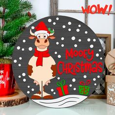 a wooden sign with a cow wearing a santa hat