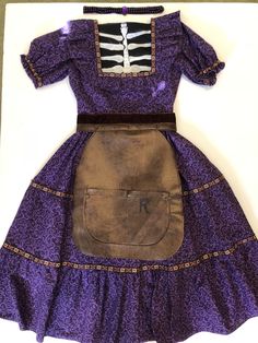 a purple dress with a skeleton on it