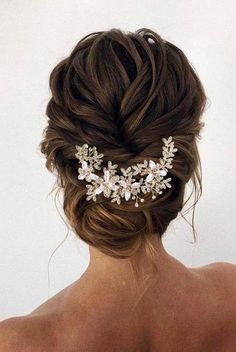 the back of a woman's head wearing a bridal hair comb