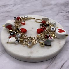 This one-of-a-kind multi heart charm chain bracelet is handcrafted personally for me, Derlis. It contains assorted golden tone heart/love charms plus several white, red, crystal, black, round, seed and heart shape beads throughout. You can pick your size bracelet between 7 & 9 inches. It can also be personalized: pick up to 2 letter charms. Perfect Valentine's Day gift for family, friends, love ones, co-workers, kids or yourself. Also, for Christmas, birthdays, anniversaries, Mother's Day and an Anniversary Gift For Girlfriend, Red Heart Earrings, 2 Letter, Black And White Heart, Valentine Ideas, Charm Chain, Love Charms, Metal Chain Link, Letter Charms