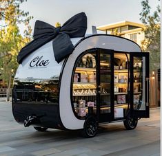 an ice cream cart with a bow on top