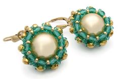 These richly colored gold and green earrings are eye-catching and will be noticed when you wear them.  Gold Swarovski pearls are set in transparent green and gold Czech fire polished beads, and Japanese seed beads. They are finished with 14k gold-filled French lever back earwires.  Approximately 3/4 inch diameter and length. Free USA shipping and sent in a gift box. Thanks for looking at my Etsy shop. Elegant Green Beaded Earrings With Gold Beads, Elegant Green Earrings With Gold Beads, Woven Earrings, Pearl Earrings Gold, Earrings Bead, Gold And Green, Mismatched Earrings, Gold Pearl Earrings, Swarovski Earrings