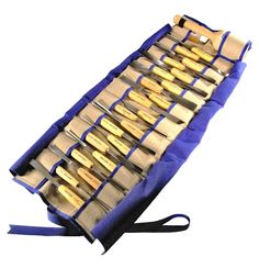 an open case with several different types of knives in it on a blue cloth bag