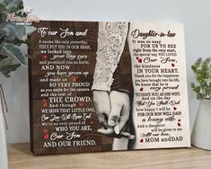 a wooden sign with the words daughter in law and two hands holding each other on it