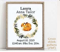 a cross stitch pattern with the name and image of a baby fox in a wreath