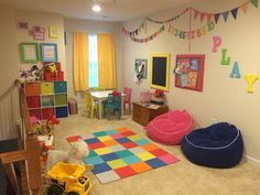 a child's playroom with toys and decor