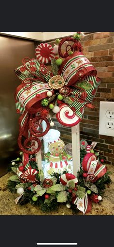 a christmas decoration with candy canes and ornaments