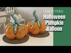 two fake pumpkins sitting on top of a table next to each other with the words how to make halloween pumpkin balloon