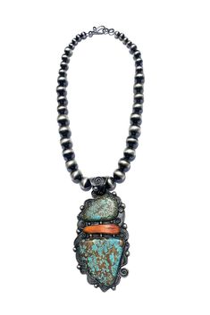 Famous Navajo artist, Chimney Butte, created this wonderfully unique necklace using 2 large pieces of the coveted Number 8 turquoise from Eureka County, Nevada. Number 8 Turquoise is a collector's item. It has not been mined since 1976. Any new pieces released are from the owner's reserve. Once the reserve is gone there will be no more material released onto the market. A large piece of Orange Spiny Shell separates the two pieces. Inverted rosettes, sterling silver beads, and filigree silverwork Turquoise Statement Necklace, Silver Eagles, Number 8, Unique Necklace, Oxidized Sterling Silver, Turquoise Pendant, Native American Jewelry, Unique Necklaces, Sterling Silver Bead