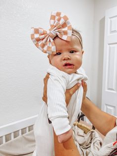 This Checkered Fancy Bullet Bow is the ultimate accessory for your little nestling. Crafted from durable bullet fabric, the Fancy bullet bow headwrap is designed to maintain its shape without sagging. Perfect for bringing home baby outfit, all the way to summer adventures! color: Peach Checkered fabric type: Bullet Our Fancy Bullet Bows come in the following options: **Headwrap (5inch bow) **Nylon (5inch bow) **Clip (5inch bow) **Piggies (two 3inch bows on clips) Headwrap Sizing: -Newborn Headwr Adjustable Detachable White Bow, Playful Adjustable Bow Headband, Playful White Decorative Bow, Playful Adjustable Bow With Matching Headband, Adjustable Playful Bow With Matching Headband, Playful White Bow With Matching Headband, Cute White Headband With Bow Tie, White Bow With Matching Headband, Adjustable Playful Bow For Playtime