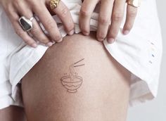 a woman with a tattoo on her thigh