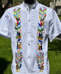 UNIQUE Embroidered Alebriges: Ancient esoteric figures of pre-hispanic Mexico                               Multicolored and unique Embroidery DOUBLE EMBROYDERY White color Short Sleeve Button-down Dress Shirt 100 % Cotton  Pre-washed Artisan Made in Mexico Care instructions: This beautiful item was handmade. To maintain the quality of the work, we recommend hand wash in cold water and air drying. Mexican Shirts For Men, Mexico Boho, Cotton Casual Dress, Mexican Beauty, Casual Dress Shirt, Mexican Shirts, Embroidered Kurti, Guayabera Shirt, Unique Embroidery