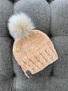 Handmade knitted hat with ethically sourced Malabrigo Rasta yarn that is 100% Merino wool.  Beautifully designed with colors that make this hat or beanie one of a kind.  It is soft, breathable and will keep you warm during those cold days.   *Tag and faux fur pom pom included. It features a detachable handmade faux fur pom pom and it is designed to fit an adult head. Care Instructions: -Remove pom pom -Hand wash, no wringing -Lay flat to air dry Pattern:  Clematis Beanie by @purlgreystitch Merino Wool Knit Beanie, Wool Knit Beanie, One Size Fits Most, Wool Beanie With Knit Fabrication, One Size, Wool Beanie With Knit Fabrication, One Size Fits Most, Cozy Merino Wool Beanie Hat, Knit Beanie Hat For Fall, Merino Wool Beanie Hat, Merino Wool Hat For Cold Weather, Merino Wool Beanie Hat One Size