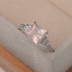 Elegant Pink Topaz Ring In Sterling Silver, Pink Sterling Silver Moonstone Promise Ring, Pink Rectangular Ring With Accent Stones, Elegant Sterling Silver Square Rings, Elegant Silver Square Rings, Elegant Square Silver Rings, Elegant Pink Moonstone Sterling Silver Ring, Pink Rectangular Stone Ring For Anniversary, Pink Princess Cut Jewelry With Center Stone