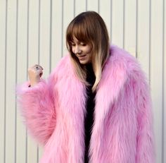 "Baby Pink Oversize Fur Coat. Luxury, fluffy fabric, very soft. 100% polyester. Handmade made in London, UK.  Oversize style. Big collar. Long sleeves. Metal snap buttons (invisible) Two side pockets. Lenght 82cm - 1cm) Handmade in UK.  Model wears size S.  HOW TO CHOOSE A SIZE ?   Using a measuring tape, measure your bust, waist and hips (widest part) and compere with size chart.  SIZE CHART: (CM) XS - B: 84 W: 66 CM H: 90 S - B: 88 W: 70 CM H: 94 M - B: 92 W: 74 CM H: 98 L - B: 96 W: 78 CM H: 102 XL - B: 100 W: 82 CM H: 106 CARE INSTRUCTIONS: Dry clean only, do not wash, do not iron, do not bleach.  Please message me before purchasing so I can check availability. If you wish this fur in any other colour, shorter or longer \"send message to seller\" and we can try to make something especi Shaggy Fur Coat, Oversized Fur Coat, Pink Fur Coat, Oversize Coat, Fluffy Fabric, Oversize Style, Fluffy Jacket, Big Collar, Pink Fur