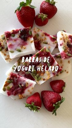 some strawberries and yogurt are on a white plate with the words barras de yogurt helado