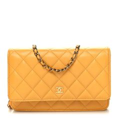 This is an authentic CHANEL Caviar Quilted Wallet on Chain WOC in Yellow. This wallet on a chainis crafted of textured caviar diamond quilted leather in yellow. The bag features a waist length gold chain link leather threaded shoulder strap and a small gold Chanel CC logo on the facing flap. This flap opens to a matching fabric interior with card slots and a full zipper and patch pocket. Elegant Yellow Leather Wallet, Elegant Yellow Wallet, Chanel Chain Bag, Chanel Crossbody, Quilted Wallet, Gold Chanel, Chanel Shoulder Bag, Wallet On Chain, Chanel Caviar