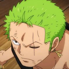 an anime character with green hair and piercings on his head looking at the camera